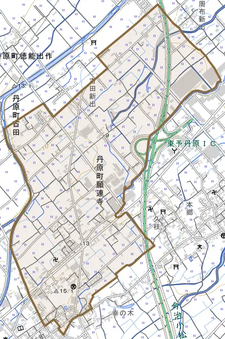 丹原町願連寺とその周辺の地図。町の範囲を重ねている