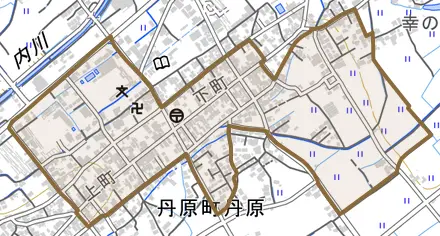 丹原町丹原とその周辺の地図。町の範囲を重ねている