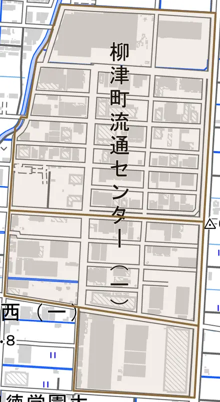 柳津町流通センターとその周辺の地図。町の範囲を重ねている