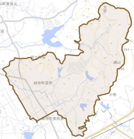 綾歌町富熊とその周辺の地図。町の範囲を重ねている