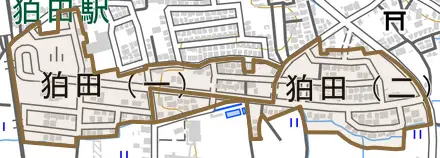狛田とその周辺の地図。町の範囲を重ねている