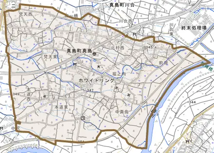 真島町真島とその周辺の地図。町の範囲を重ねている